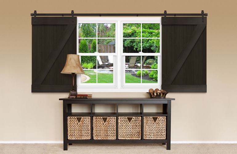 Window covered by sliding barn doors